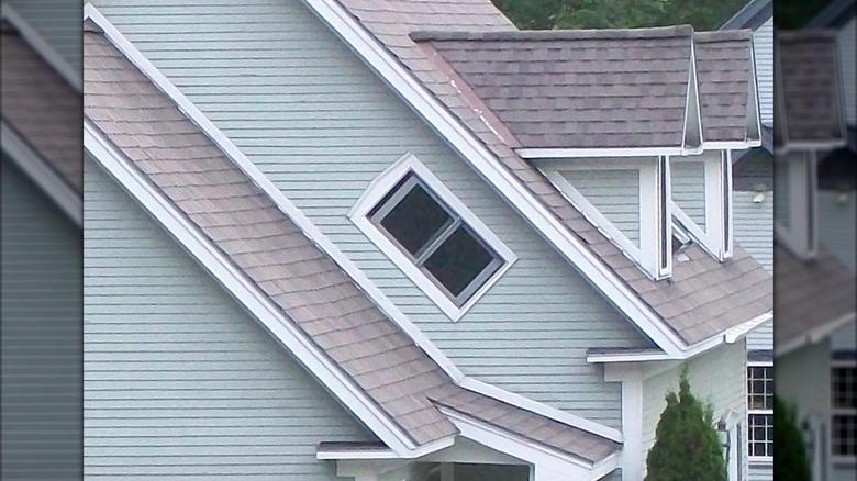 a witch window installed in the gable of a home