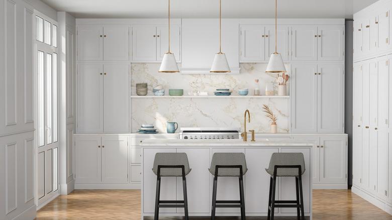 modern white kitchen with ceiling height cabinets