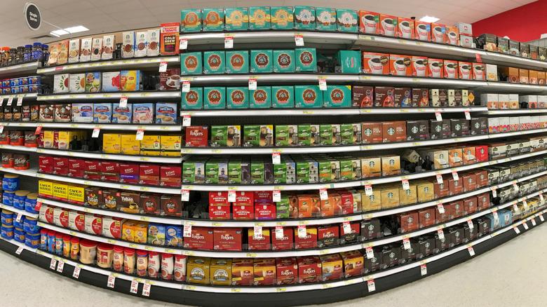 display of dozens of single-cup coffee flavors in a grocery aisle
