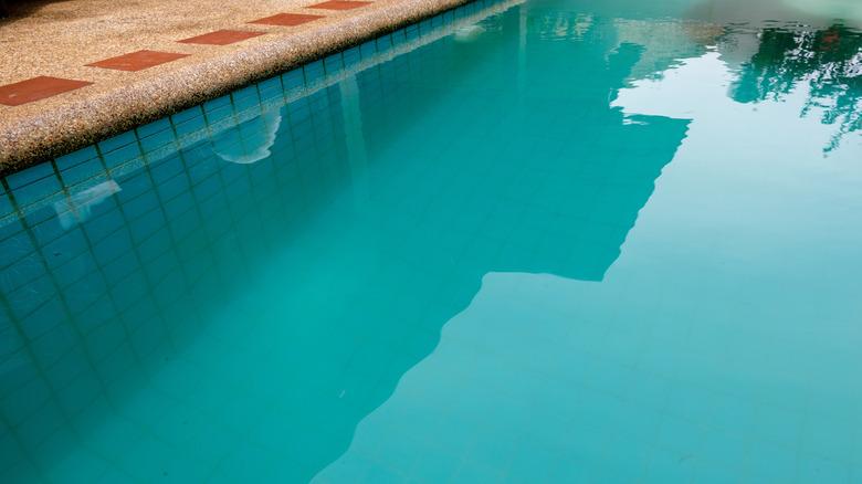 Swimming pool with cloudy, murky water