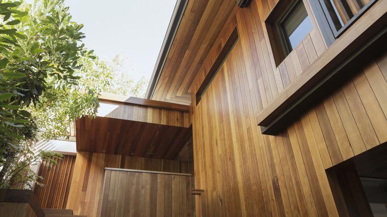 stained wooden siding visible on a house